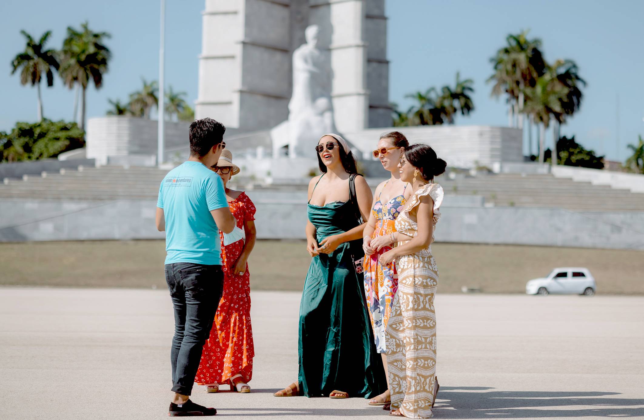 A Cuban Adventures tour guide with his tour group in Havana A tour group with their Cuban Adventures tour guide in Havana