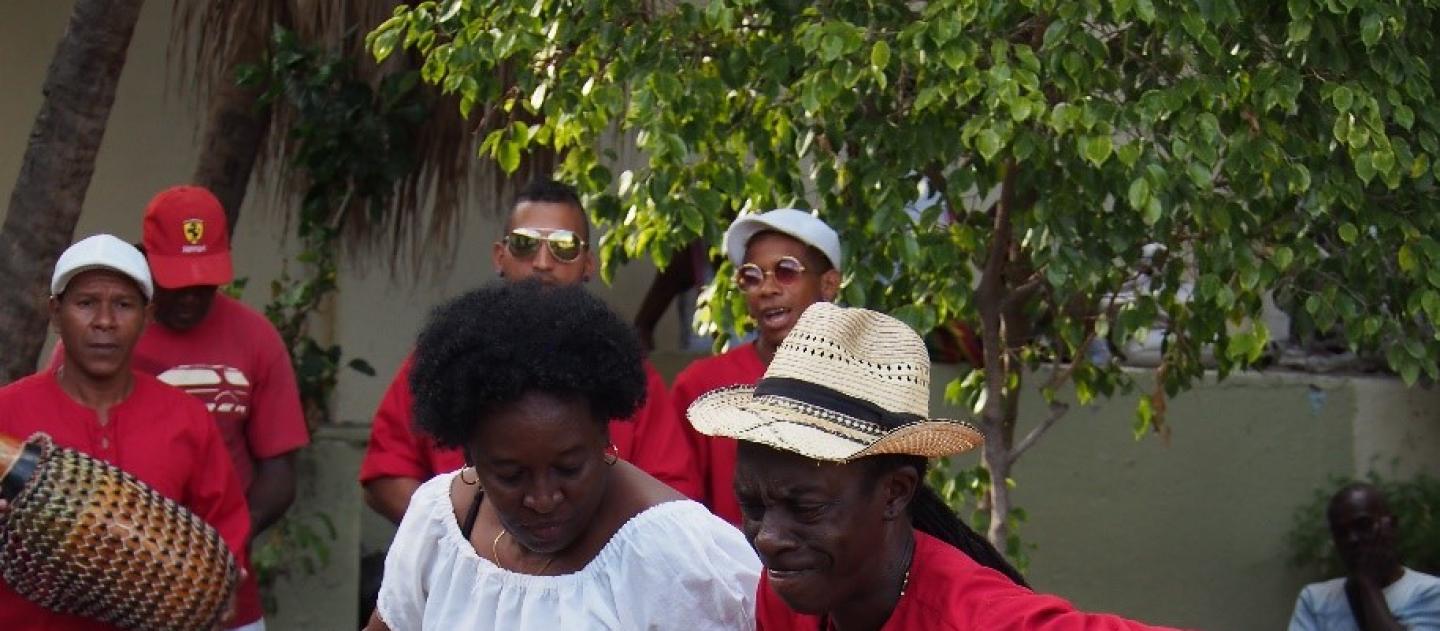a man and woman dance the rumba to live music