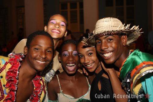Children with dancers in Santiago de Cuba's Carnival