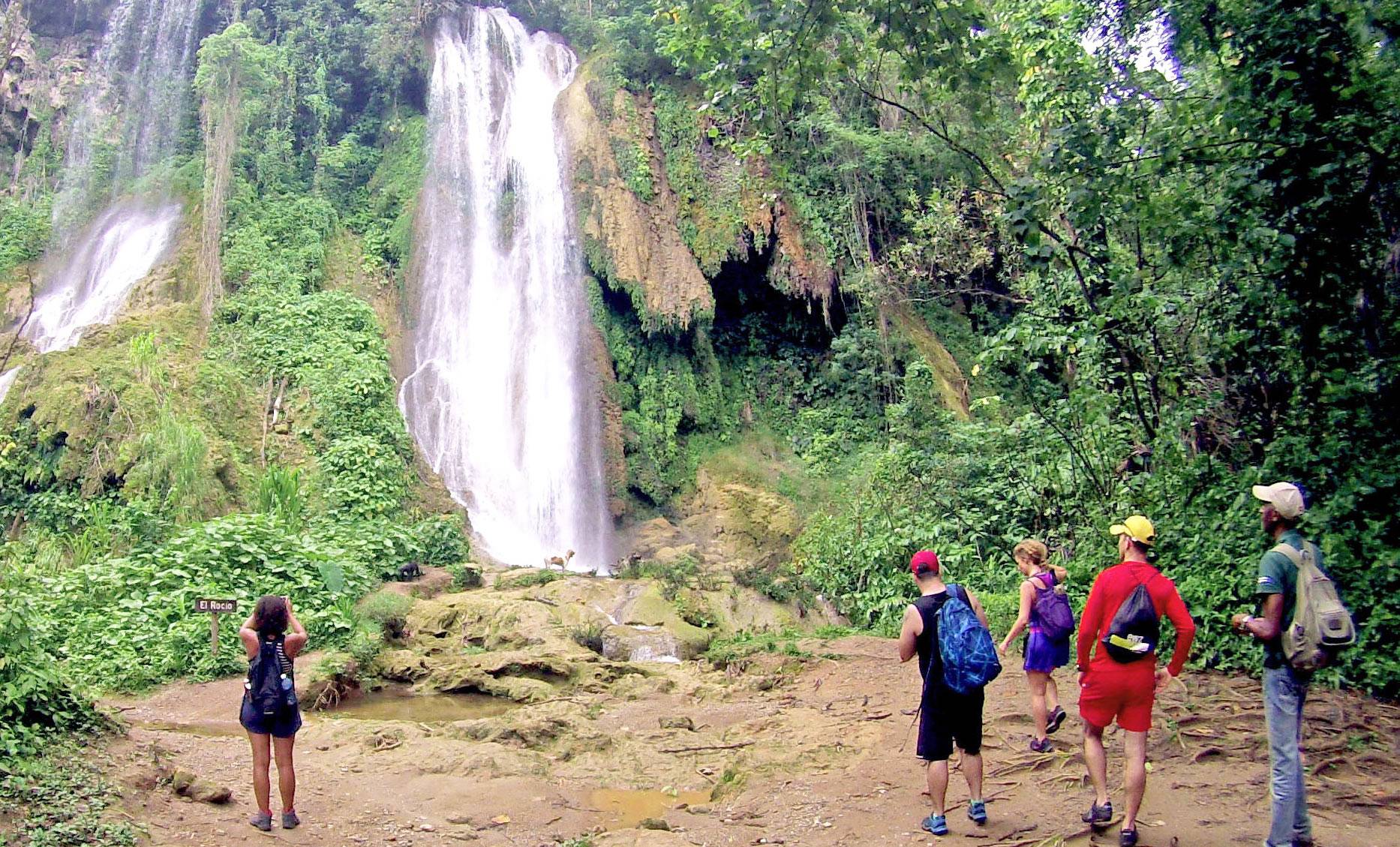 A Cuban Adventures tour group arrives to the El Rocio waterfall in Parque Guanayara in the Sierra del Escambray mountains, Cuba