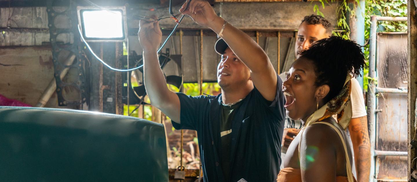 Group with tour leader inside workshop