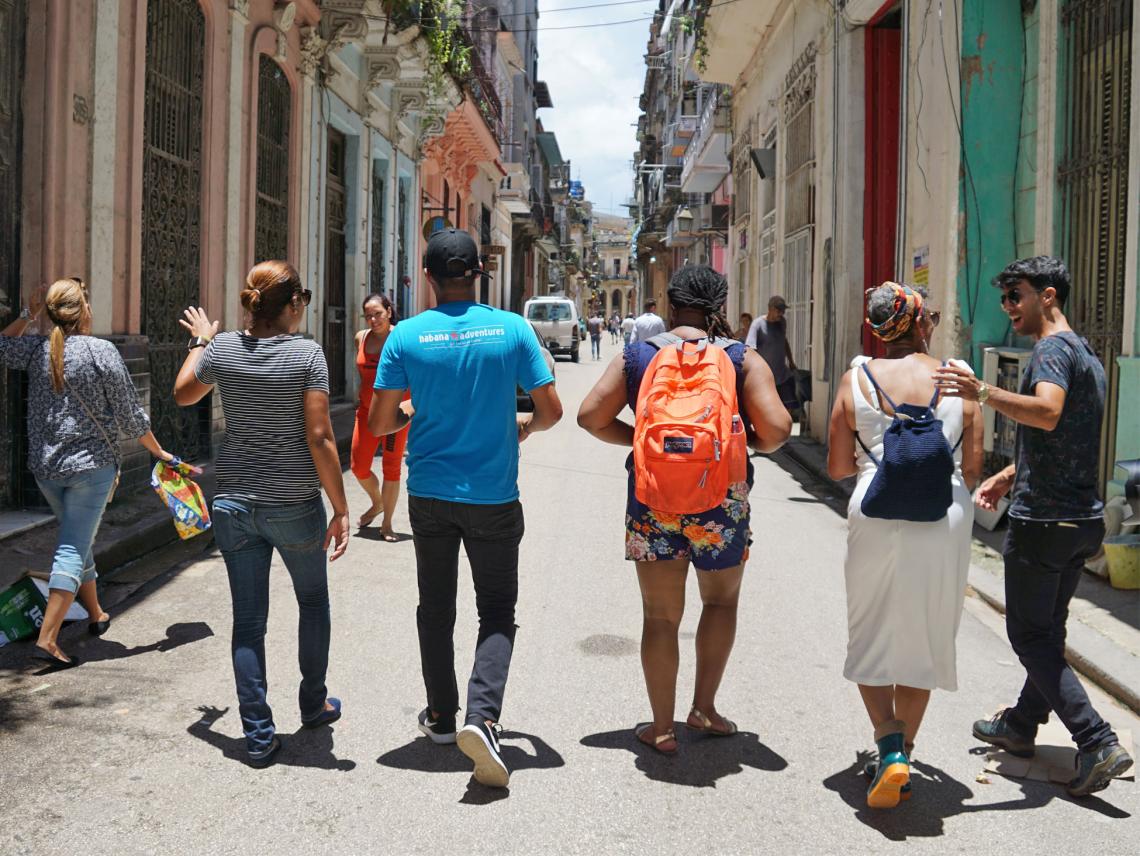 Team walking along Havana's street